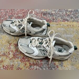 New Balance 530 sneaker. Size 7, I normally wear 7.5 color sea salt/green.